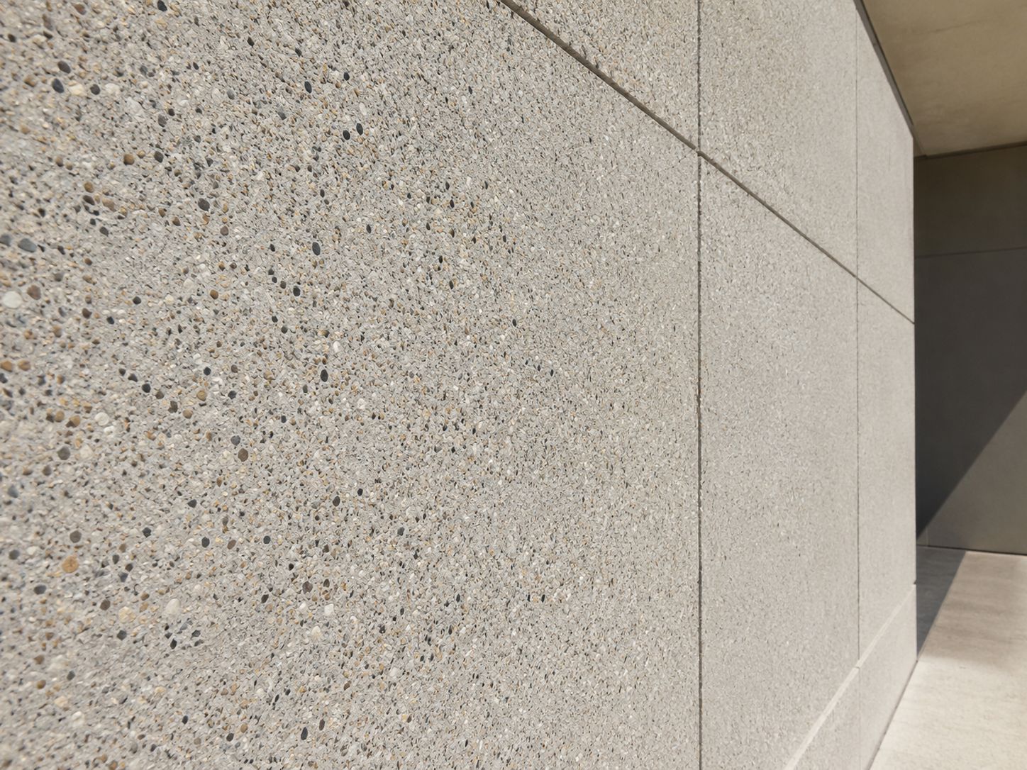 Exposed aggregate precast concrete finish showing stone texture and surface depth